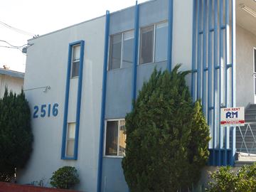Redondo Beach apartment for rent - A blue and white building with a sign that says "For Rent".