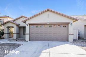 Surprise house for rent - A house with a garage door that says "FirstKey Homes".