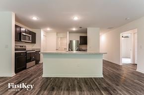 Port Charlotte house for rent - a renovated kitchen with a counter top in the middle