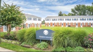 Elkton apartment for rent - an image of a campus with a sign in front of a building
