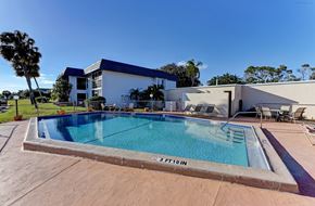 Bradenton house for rent - a swimming pool with a building in the background