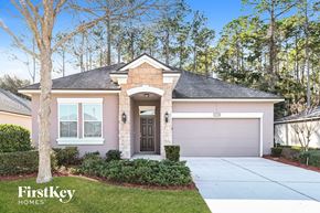 Jacksonville house for rent - a home with a driveway and a garage door