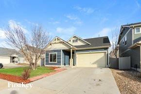 Denver house for rent - A house with a blue garage door is for sale.
