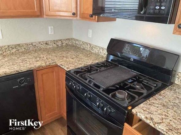 Commerce City house for rent - a kitchen with a stove and a counter top