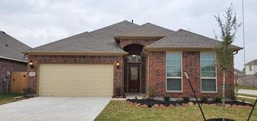 Missouri City house for rent - a brick house with a garage door