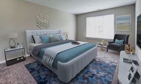 Largo apartment for rent - a bedroom with a white bed and blue pillows