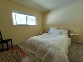 Davis apartment for rent - A bedroom with a large bed and a window.