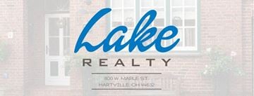 Hartville apartment for rent - Lake Realty sign in front of a brick building.