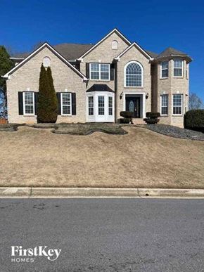 Conyers house for rent - a house with a lawn in front of it