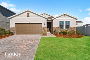 Riverview house for rent - a new home with a garage door in front of it