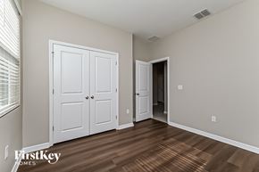 Riverview house for rent - a bedroom with two closets and a door to a hallway