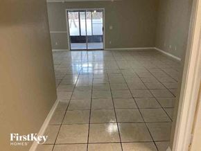 Jacksonville house for rent - A room with tile flooring and a doorway leading to another room.
