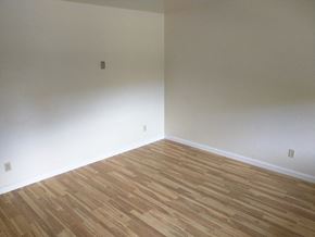 Davis apartment for rent - an empty room with a wooden floor and white walls