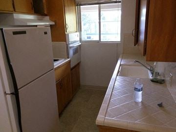 Davis apartment for rent - a kitchen with a sink and a refrigerator