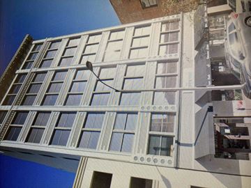 Pasadena apartment for rent - A building with a lot of windows and a street light.