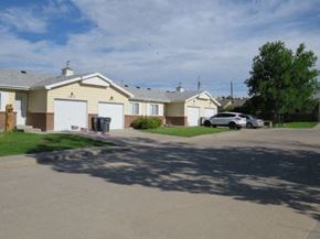 Cheyenne townhouse for rent - a street of houses with cars parked in the driveway