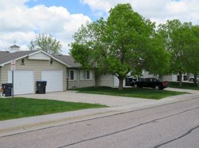 Cheyenne apartment for rent - a house with a car parked in the driveway