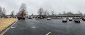 Bella Vista apartment for rent - A parking lot with cars parked in it.