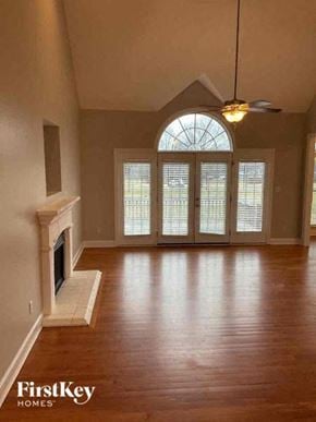 Statesville house for rent - an empty living room with a fireplace and wood floors