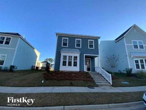 Summerville house for rent - a blue house with a sidewalk in front of it