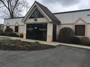 West Springfield apartment for rent - the front of a building with a black door and a sidewalk