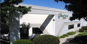 San Marcos apartment for rent - a white building with a sign on the side of it
