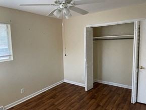 Cedartown apartment for rent - an empty bedroom with a closet and a ceiling fan