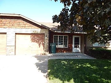Hayden house for rent - a small brick house with a sidewalk in front of it