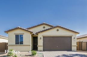 Maricopa house for rent - a house with a garage door in front of it