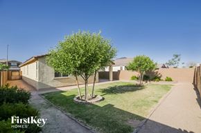 Maricopa house for rent - a house with a yard and trees in front of it