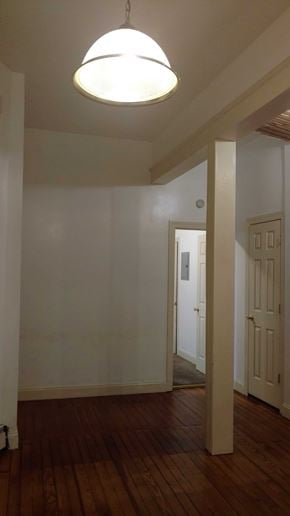 Easton apartment for rent - A hallway with a light hanging from the ceiling and a door at the end.