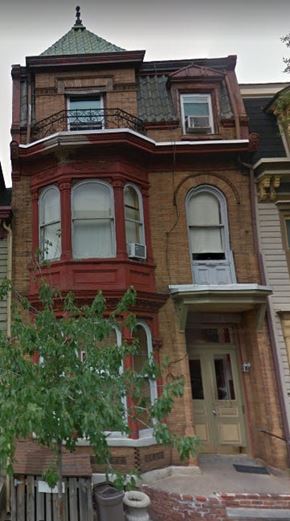 Easton apartment for rent - A red and brown Victorian style house with a green roof.