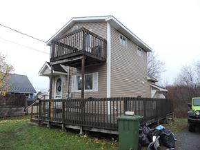 Westville apartment for rent - the back of our house with a deck and a garbage can