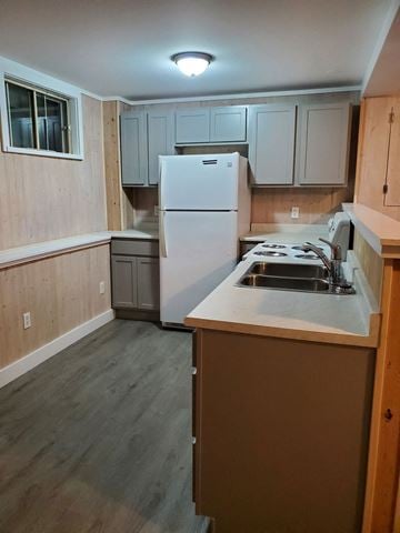 Westville apartment for rent - a small kitchen with white appliances and wooden cabinets