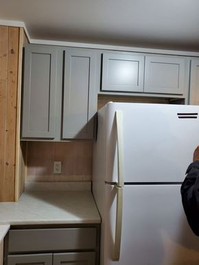Westville apartment for rent - a kitchen with white cabinets and a white refrigerator