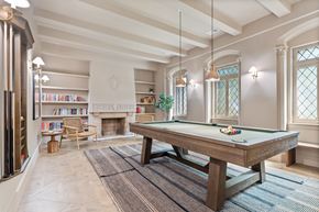 Chicago apartment for rent - A room with a pool table and a fireplace.