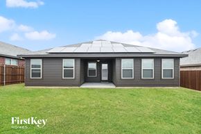 Fort Worth house for rent - a home with a porch and a grass yard