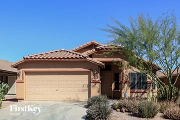 Laveen house for rent - a house with a garage door in front of it