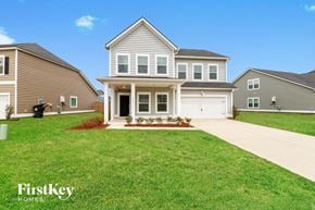 Summerville house for rent - A large house with a driveway in front of it.