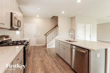 Summerville house for rent - A kitchen with a stove top oven and a dishwasher.