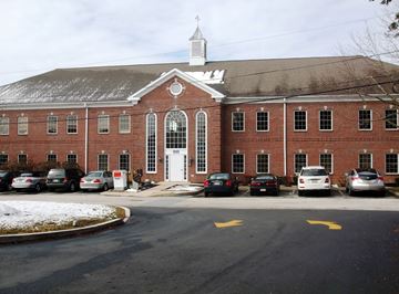 West Chester apartment for rent - A church with a white steeple and a parking lot in front.