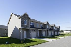Chambersburg apartment for rent - A row of houses with a clear blue sky above them.