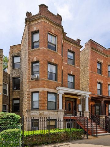 Chicago apartment for rent - a large brick building with a porch and