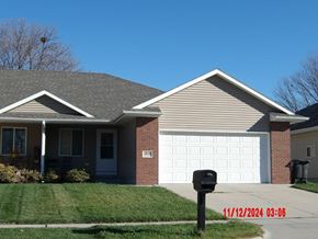 Fremont apartment for rent - A house with a grey roof and a white garage door.