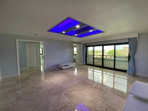 Tamuning house for rent - an empty living room with a blue ceiling light