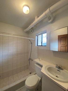 Mongmong-Toto-Maite apartment for rent - a white bathroom with a sink and a toilet