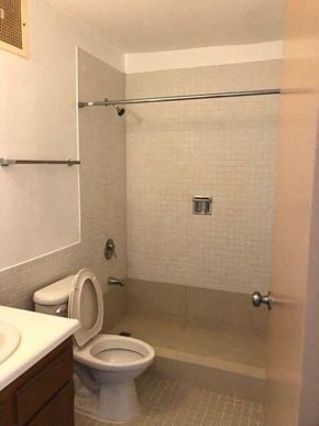 Sinajana apartment for rent - a bathroom with a toilet and a shower