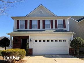 Matthews house for rent - a house with a white garage door in front of it