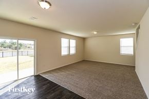 Jacksonville house for rent - A room with a carpet floor and a window.