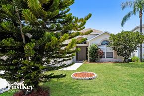 Saint Cloud house for rent - a home with a garden and a tree in the yard